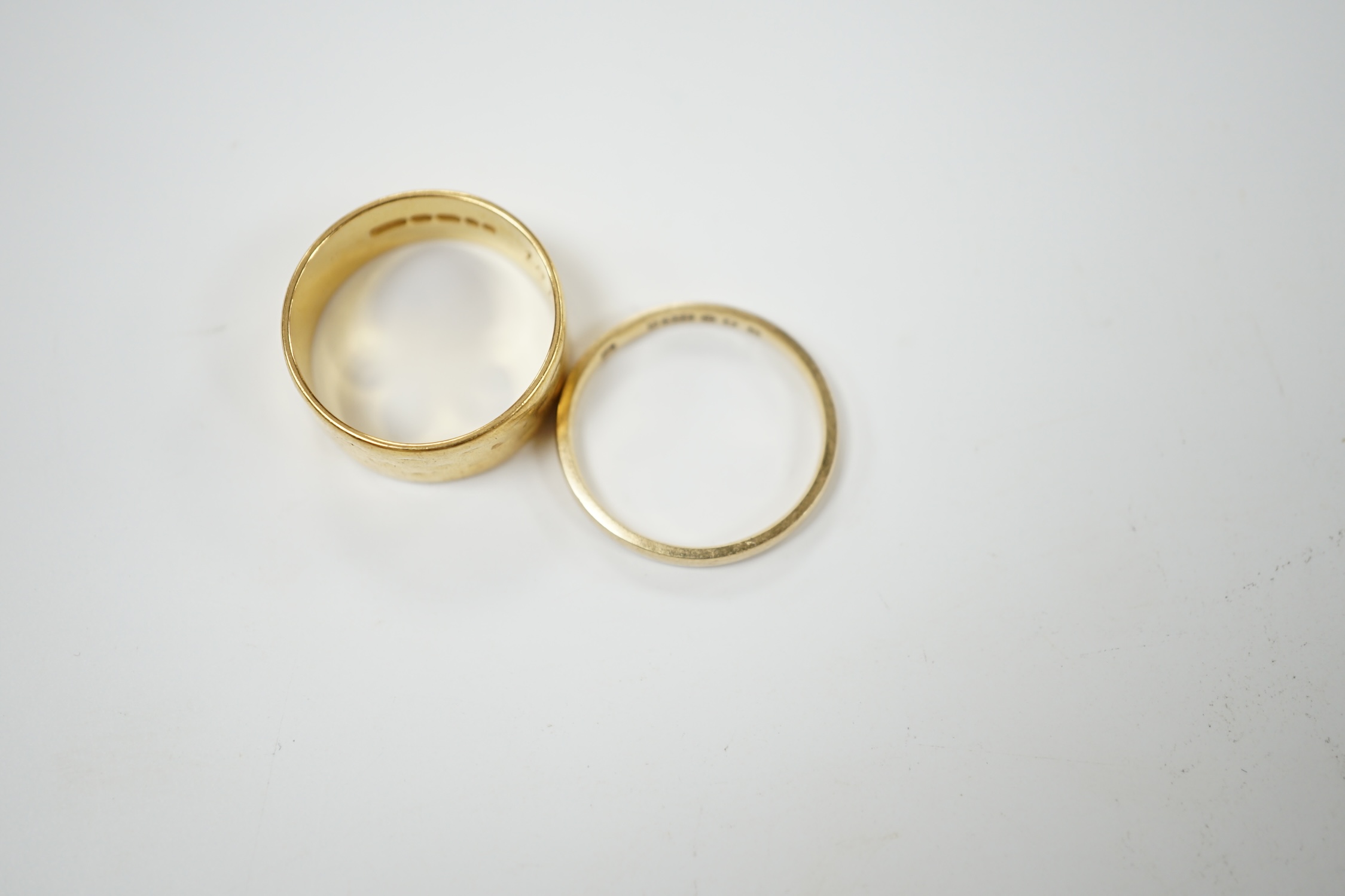 A 22ct gold wedding band, size P, 6.8 grams and a 9ct wedding band, 1.5 grams. Condition - fair